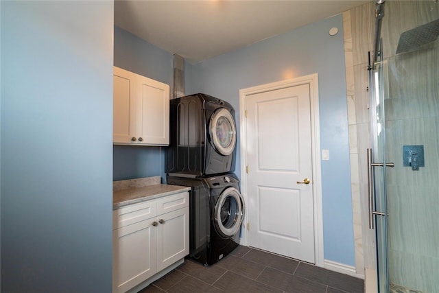 125 S Bay Dr, Babylon, NY 11702 - washroom with stacked washer / dryer and cabinet space