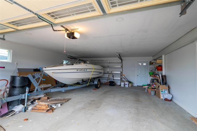 125 S Bay Dr, Babylon, NY 11702 - garage featuring a garage door opener