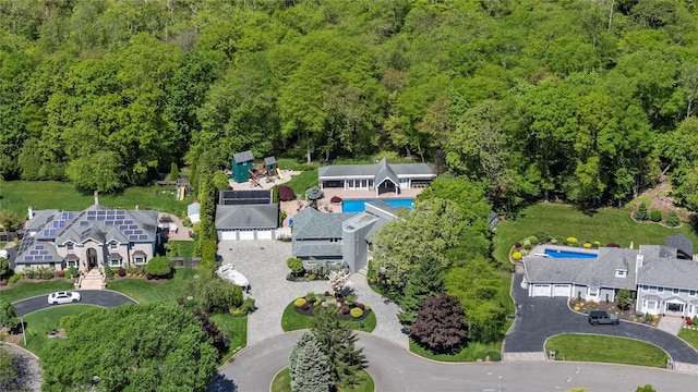 10 Crick Holly Ln, East Islip, NY 11730 - aerial view of property and surrounding area featuring a forest and a pool