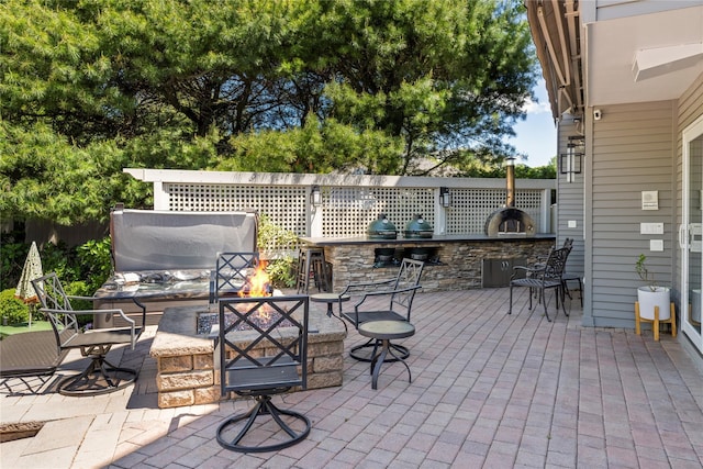 10 Crick Holly Ln, East Islip, NY 11730 - view of patio with area for grilling and an outdoor fire pit