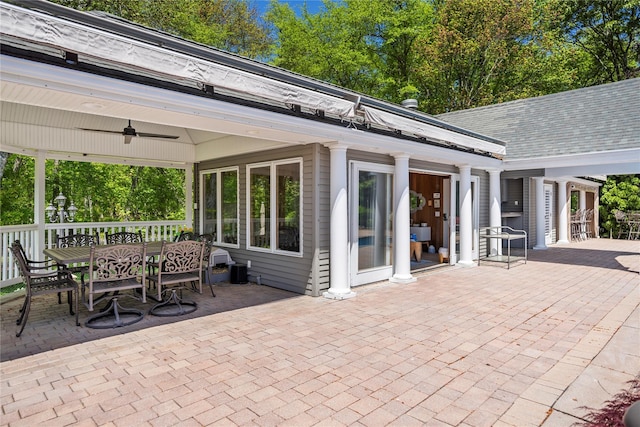 10 Crick Holly Ln, East Islip, NY 11730 - view of patio with a ceiling fan, outdoor dining space, and view of wooded area