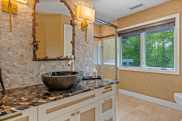 10 Crick Holly Ln, East Islip, NY 11730 - full bath featuring vanity, toilet, an enclosed shower, baseboards, and wallpapered walls