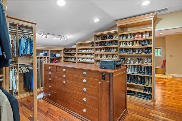 10 Crick Holly Ln, East Islip, NY 11730 - spacious closet with wood finished floors and lofted ceiling