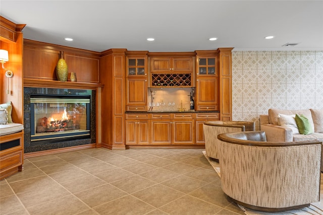 10 Crick Holly Ln, East Islip, NY 11730 - indoor bar with recessed lighting, a high end fireplace, light tile patterned flooring, and crown molding