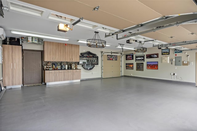 10 Crick Holly Ln, East Islip, NY 11730 - garage featuring electric panel, a garage door opener, and baseboards