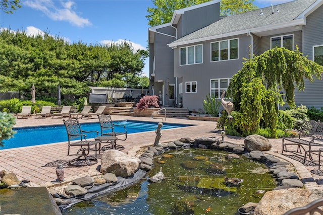 10 Crick Holly Ln, East Islip, NY 11730 - outdoor pool featuring a patio area
