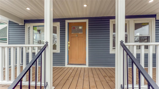 view of exterior entry with a porch