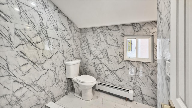 half bathroom with a baseboard radiator, toilet, and marble finish floor