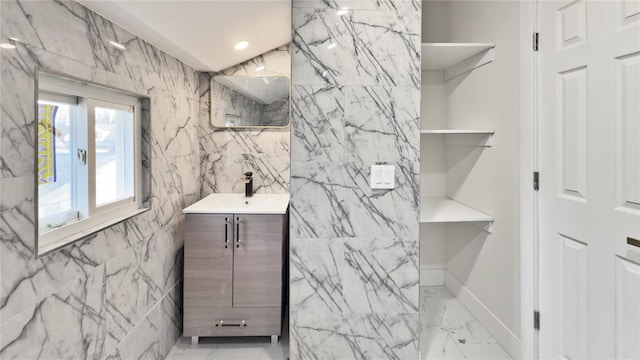 bathroom featuring recessed lighting, tile walls, marble finish floor, and vanity