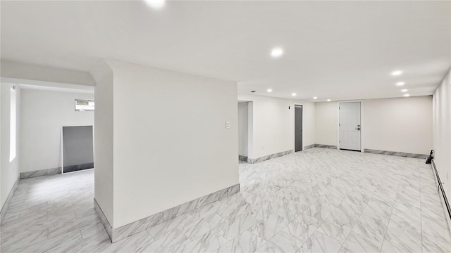 interior space with recessed lighting, baseboards, and marble finish floor