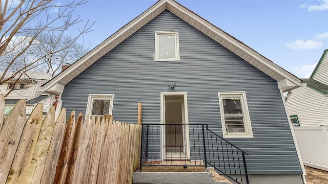 back of house featuring fence