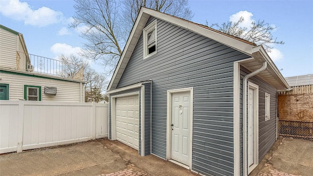 garage with fence
