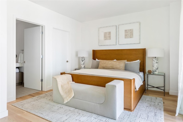 bedroom with wood finished floors
