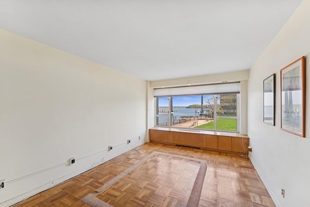 166-25 Powells Cove Blvd Unit 1A, Whitestone, NY 11357 - unfurnished room featuring a water view and baseboards