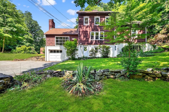 285 Grand St, Croton-On-Hudson, NY 10520 - shingle-style home with asphalt driveway, a chimney, an attached garage, a front lawn, and roof with shingles