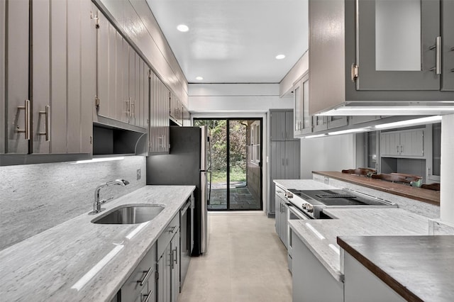 285 Grand St, Croton-On-Hudson, NY 10520 - kitchen with gray cabinetry, appliances with stainless steel finishes, recessed lighting, tasteful backsplash, and light stone counters