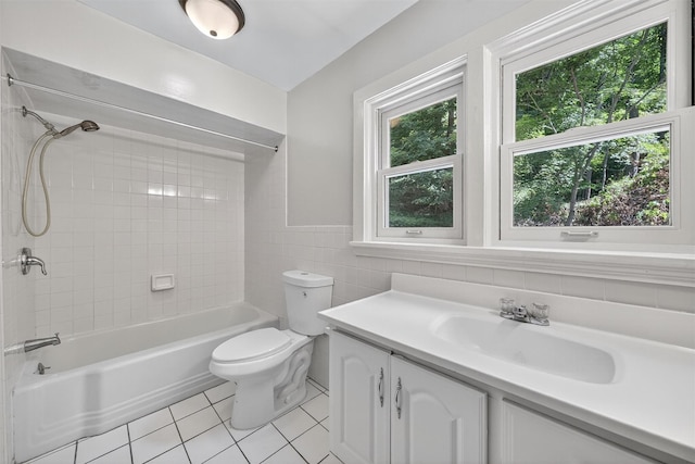 285 Grand St, Croton-On-Hudson, NY 10520 - bathroom featuring tile patterned flooring, tile walls,  shower combination, vanity, and a wainscoted wall