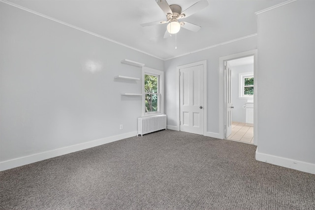 285 Grand St, Croton-On-Hudson, NY 10520 - unfurnished bedroom with radiator, multiple windows, carpet, crown molding, and a closet