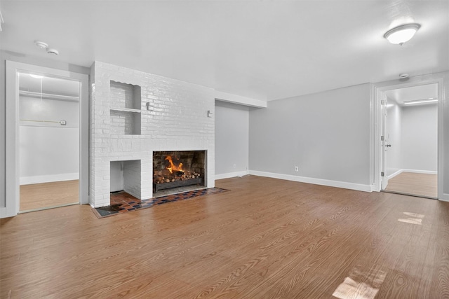 285 Grand St, Croton-On-Hudson, NY 10520 - unfurnished living room with a fireplace and wood finished floors