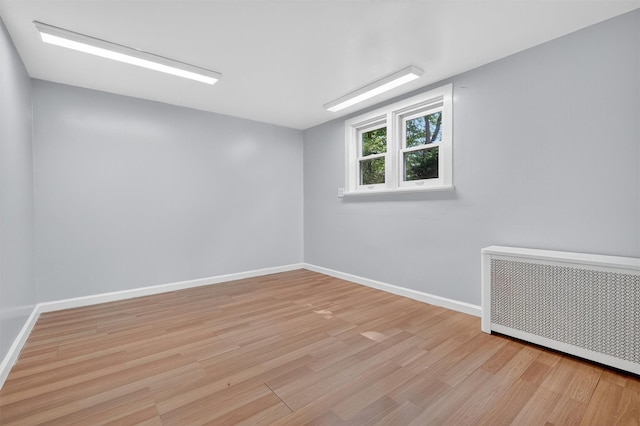 285 Grand St, Croton-On-Hudson, NY 10520 - empty room with radiator and light wood-style flooring