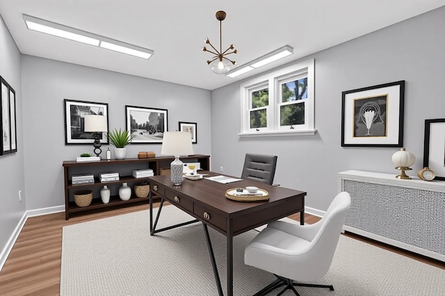 285 Grand St, Croton-On-Hudson, NY 10520 - office with light wood-type flooring, a chandelier, and radiator