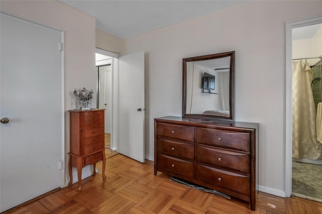3131 Grand Concourse Unit 11J, Bronx, NY 10468 - bedroom with baseboards and ensuite bath