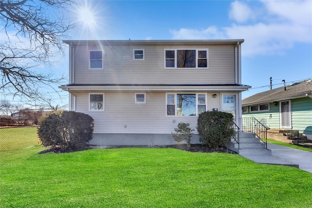 7 Howard Ave, Freeport, NY 11520 - back of house with a yard and fence