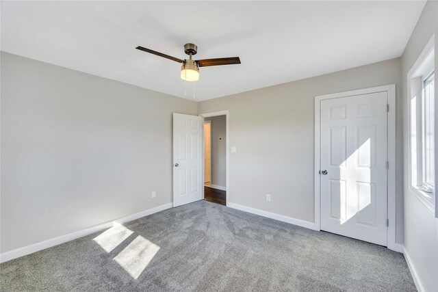 7 Howard Ave, Freeport, NY 11520 - unfurnished bedroom with multiple windows, baseboards, and carpet