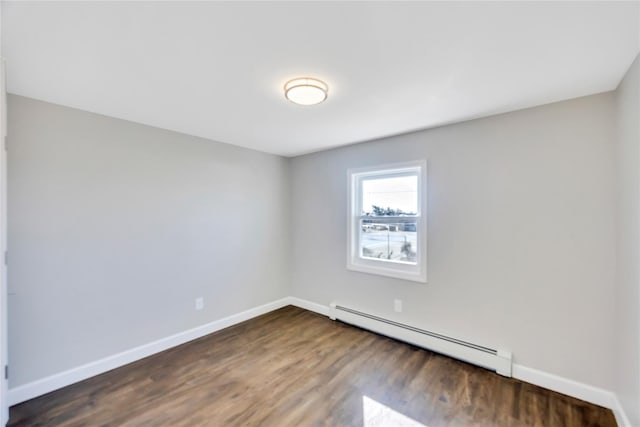 7 Howard Ave, Freeport, NY 11520 - unfurnished room with baseboards, baseboard heating, and dark wood-style flooring
