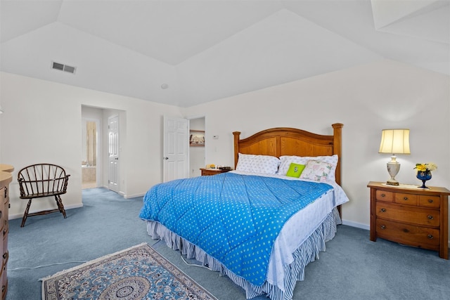 bedroom featuring baseboards, ensuite bath, visible vents, vaulted ceiling, and carpet floors