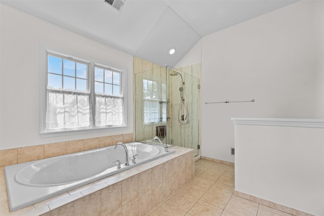 full bathroom featuring a garden tub, tile patterned floors, visible vents, a shower stall, and vaulted ceiling