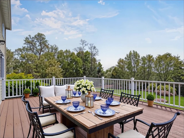 deck featuring outdoor dining area