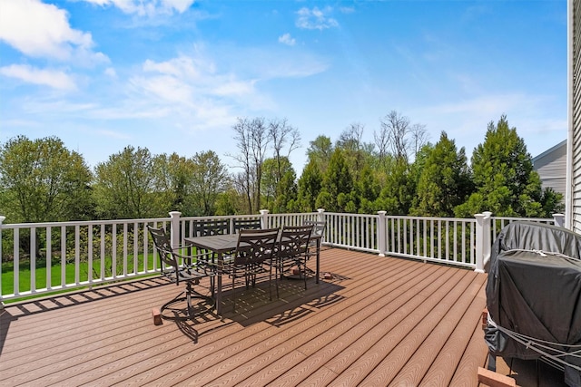 deck featuring outdoor dining area