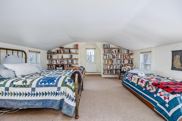 bedroom featuring multiple windows, carpet, a baseboard heating unit, and lofted ceiling