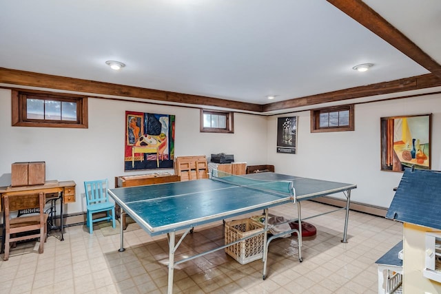 recreation room with light floors and baseboard heating