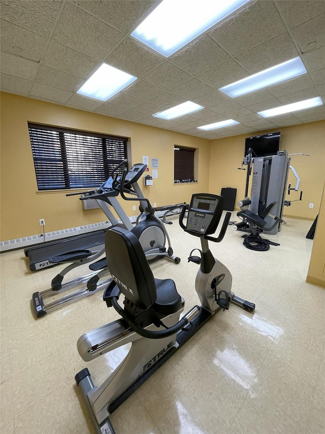 1259 Grant Ave Unit 8A, Bronx, NY 10456 - gym featuring tile patterned floors, baseboards, and a paneled ceiling
