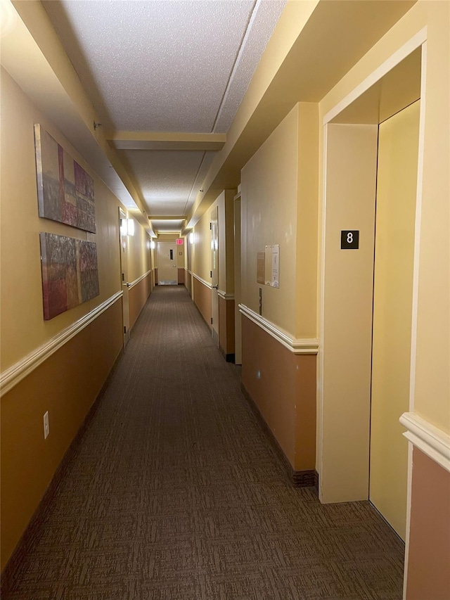 1259 Grant Ave Unit 8A, Bronx, NY 10456 - hall with elevator, a textured ceiling, and carpet
