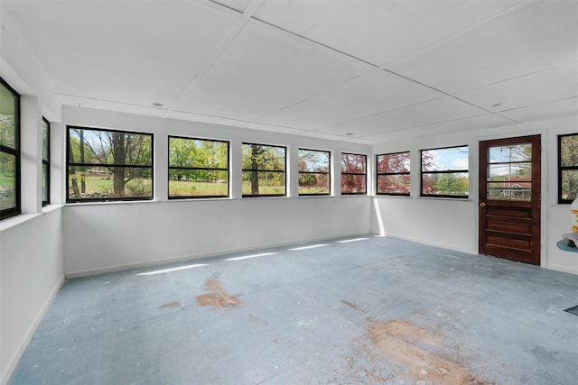 unfurnished sunroom featuring a wealth of natural light