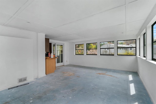 unfurnished sunroom with visible vents