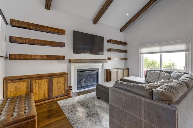 living room with a glass covered fireplace, vaulted ceiling with beams, dark wood-style floors, and recessed lighting