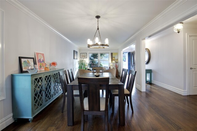 dining room with crown molding, baseboards, a notable chandelier, and wood finished floors