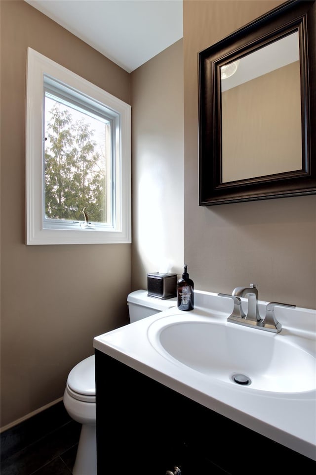 bathroom with vanity and toilet