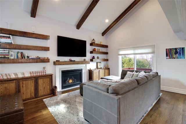 living room featuring a fireplace, baseboards, beam ceiling, and dark wood-style flooring
