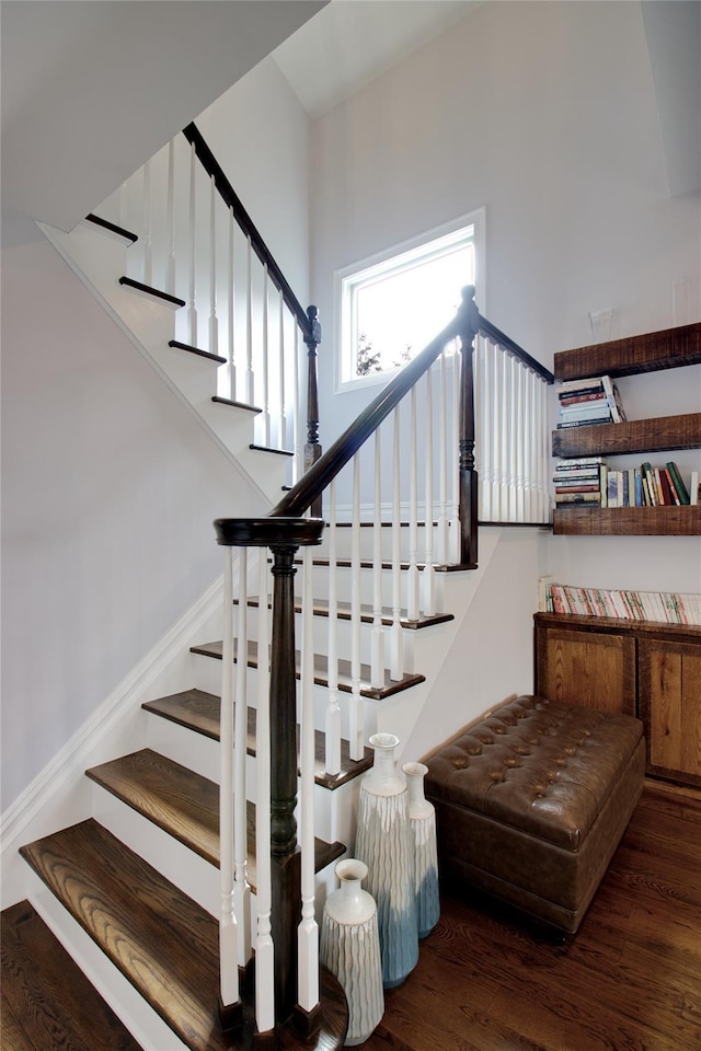 staircase featuring wood finished floors