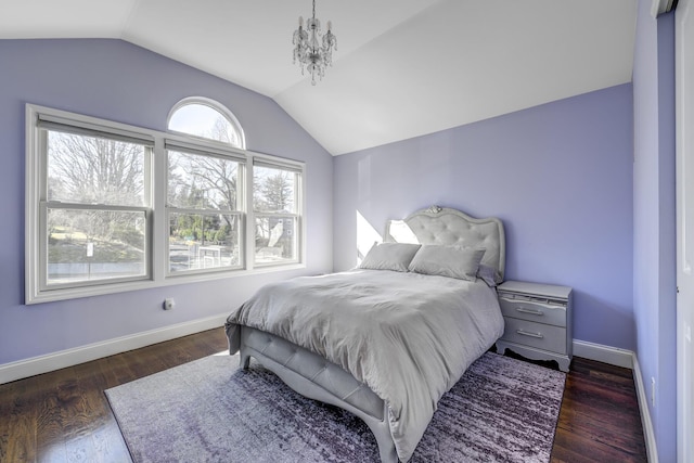bedroom featuring vaulted ceiling, baseboards, and dark wood finished floors