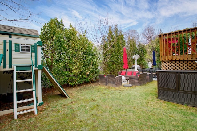 view of yard featuring a playground and an outdoor hangout area