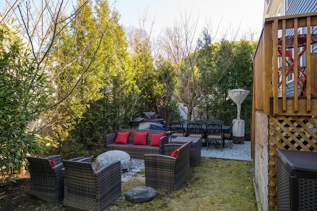 exterior space with an outdoor living space and a patio area