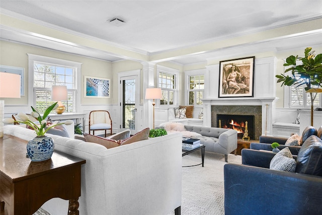 33 Fernwood Rd, Larchmont, NY 10538 - living room with a wainscoted wall, a high end fireplace, ornamental molding, a decorative wall, and decorative columns