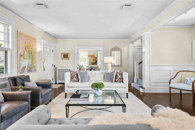 33 Fernwood Rd, Larchmont, NY 10538 - living room with crown molding, stairs, wood finished floors, radiator, and decorative columns