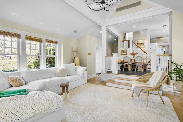 33 Fernwood Rd, Larchmont, NY 10538 - living room with visible vents, decorative columns, vaulted ceiling with beams, and stairs